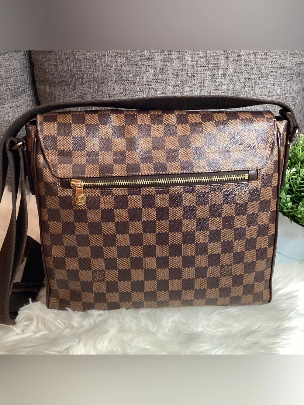 Louis Vuitton Damier Ebene District MM messenger bag.